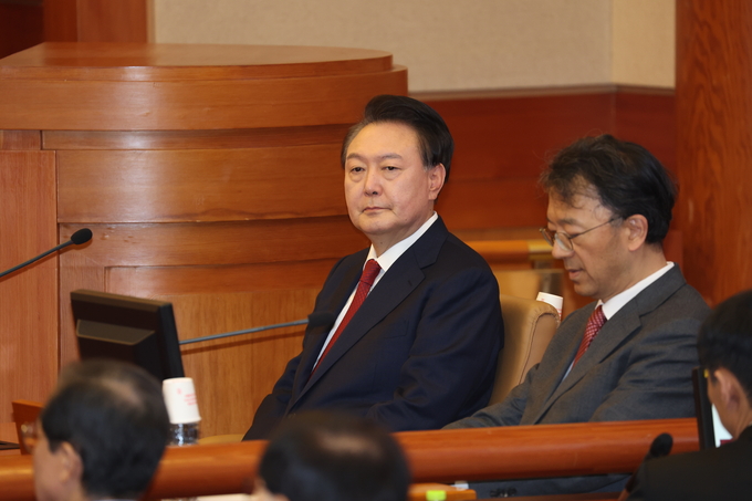 윤석열 대통령이 21일 서울 종로구 헌법재판소에서 열린 윤석열 대통령 탄핵심판 3차 변론기일에 참석하고 있다. (사진=사진공동취재단)